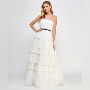 Floor-sweeping tulle, faux pearls, & a velvet belt pull this gorgeous look